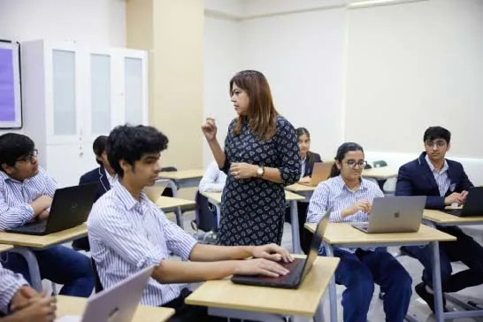 Teacher teaching their students IBDP lectures in school