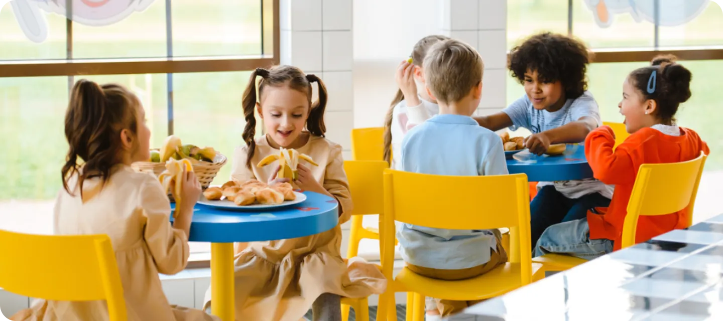 Little kids having their foods in enrichment cell